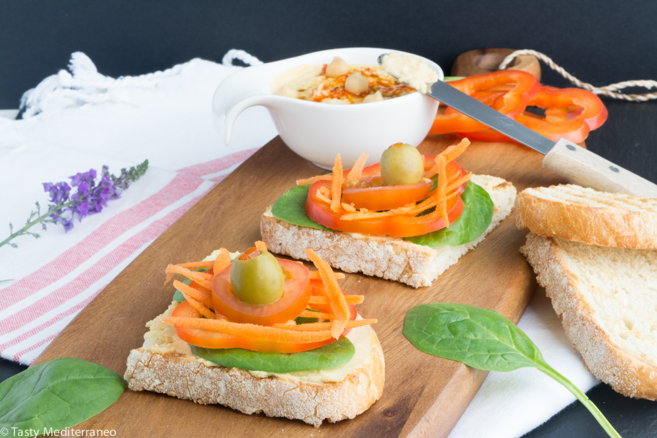 Tasty-mediterraneo-hummus-veggies-olives-on-toast