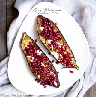 Roasted aubergine with tarator sauce & pomegranate seeds